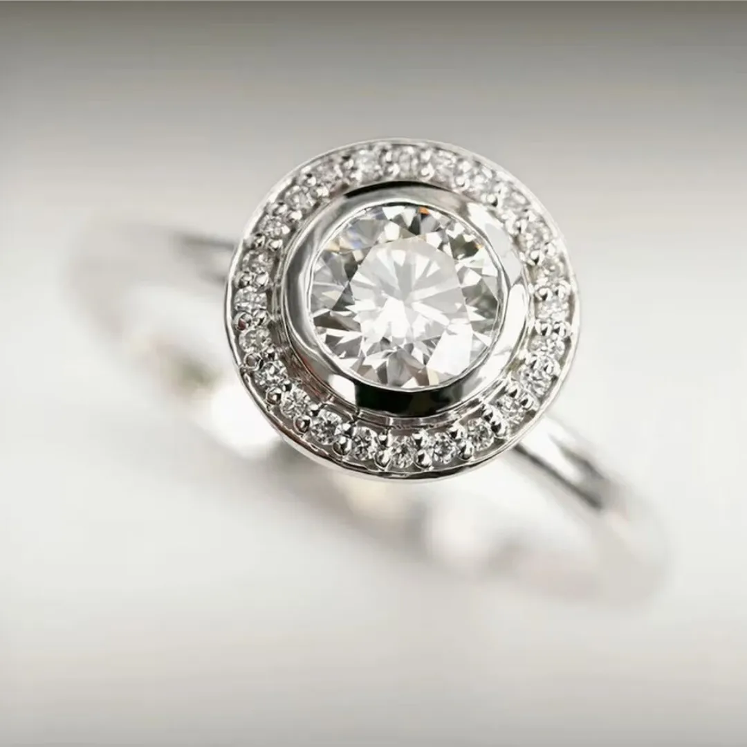 /public/photos/live/Floating Bezel Set Halo Round Moissanite Ring 699 (2).webp